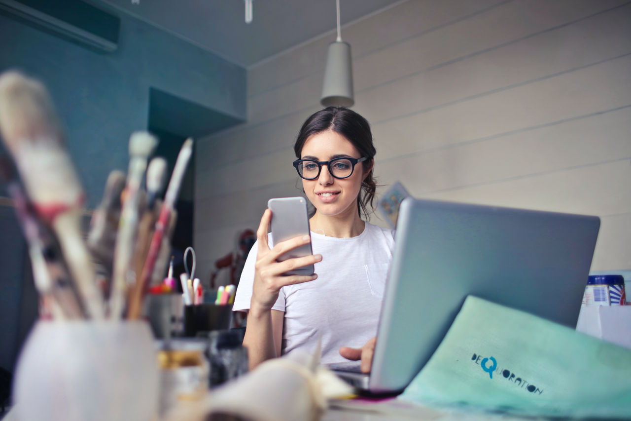 woman smiling at phone