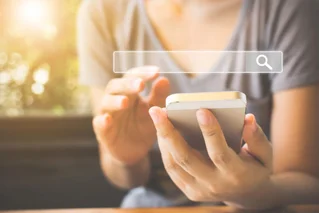 Woman searching on a mobile phone